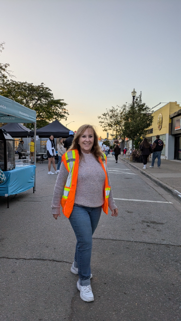 Michelle Seaborn at the Farmers' Market of Grimsby wearing a construction vest.